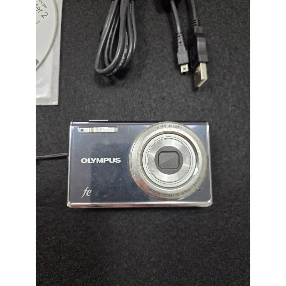 Olympus FE-4010 digital camera box featuring a 12-megapixel sensor and 4x Zoom